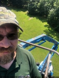 Bat removal from tall chimney in Clinton CT using 60ft boom lift