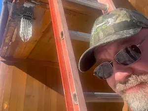 Waterford CT squirrel removal one way Door and Rich RF Wildlife on ladder during install 2026.