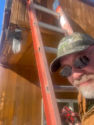 Waterford CT squirrel removal one way Door and Rich RF Wildlife on ladder during install 2026.